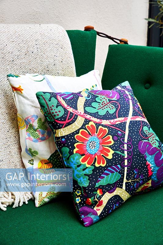Green sofa with colourful cushions - detail 