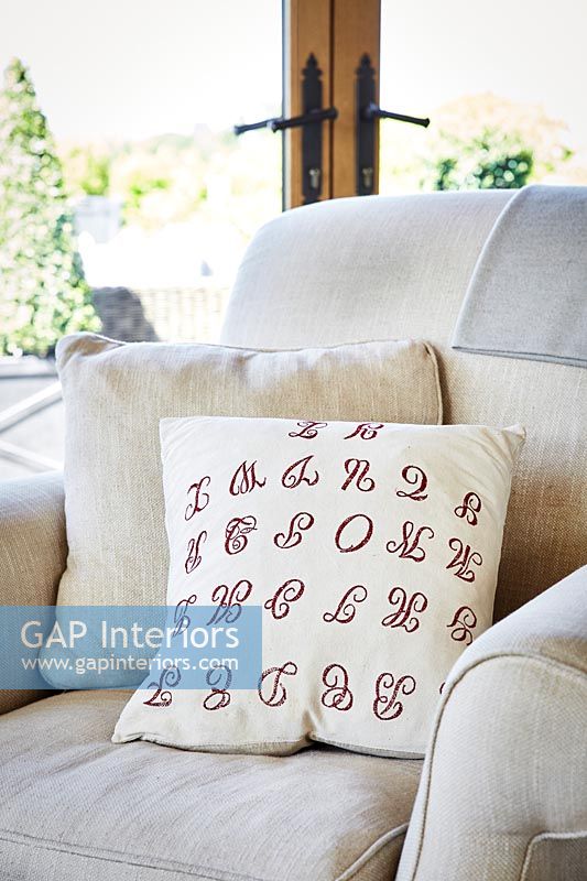 Patterned cushion on armchair 
