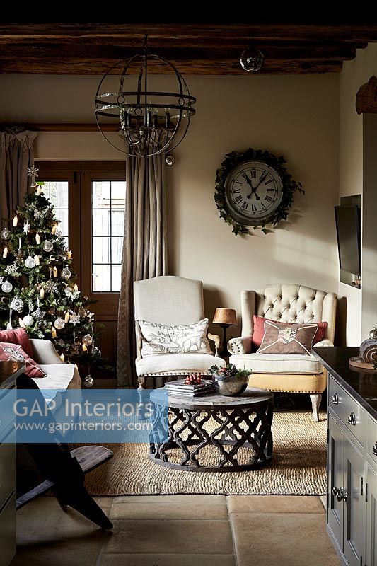 Snug next to country kitchen decorated for Christmas 