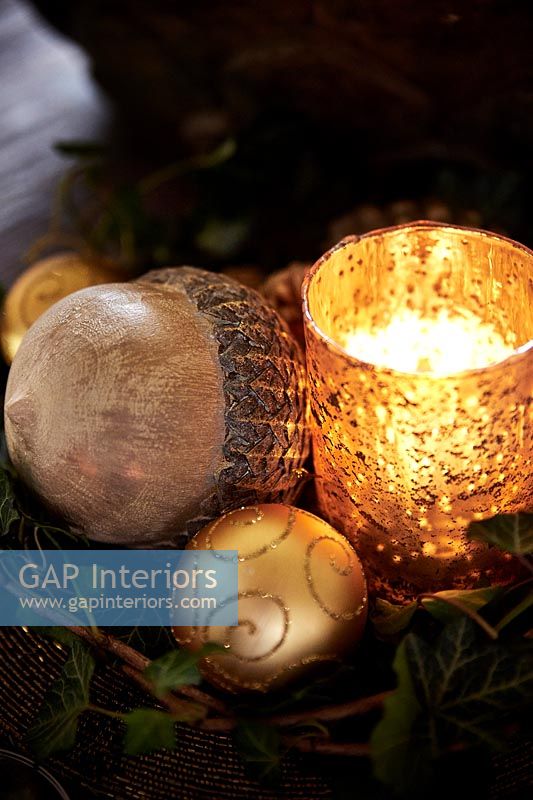 Gold candle holder and baubles 