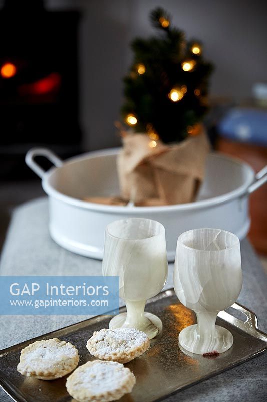 Close up Christmas mince pies and goblets 