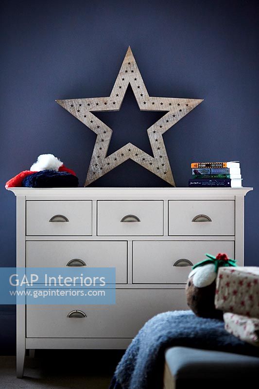 Star light on chest of drawers at Christmas 