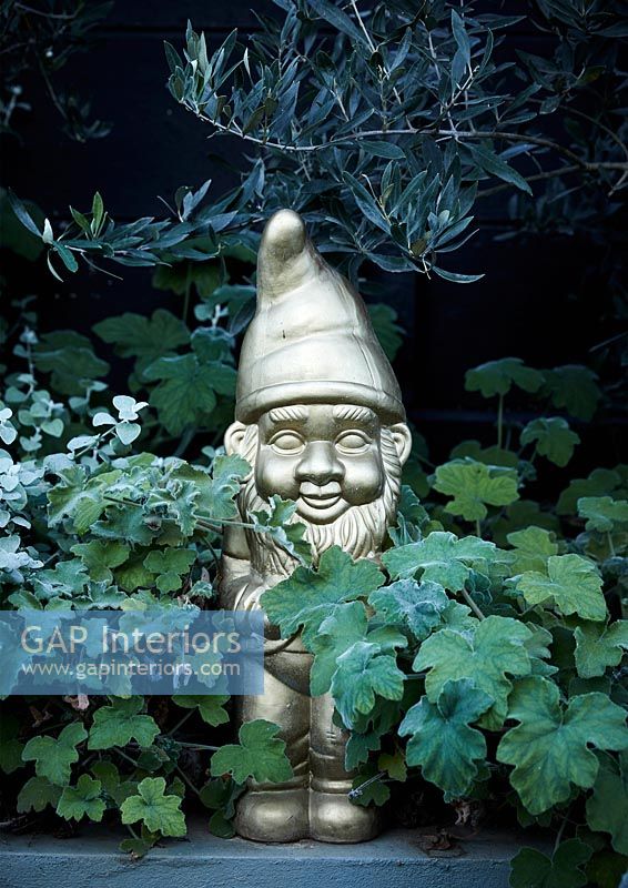 Gold gnome among plants 