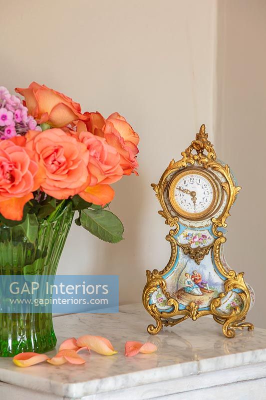 Ornate clock and roses 
