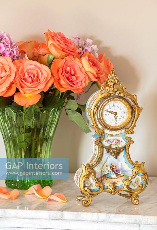 Ornate clock and roses 