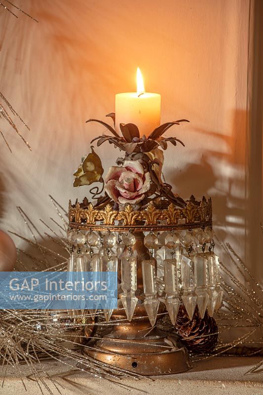 Ornate candle on mantelpiece 