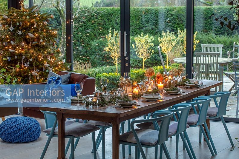 Modern dining room with view to garden - decorated for Christmas 