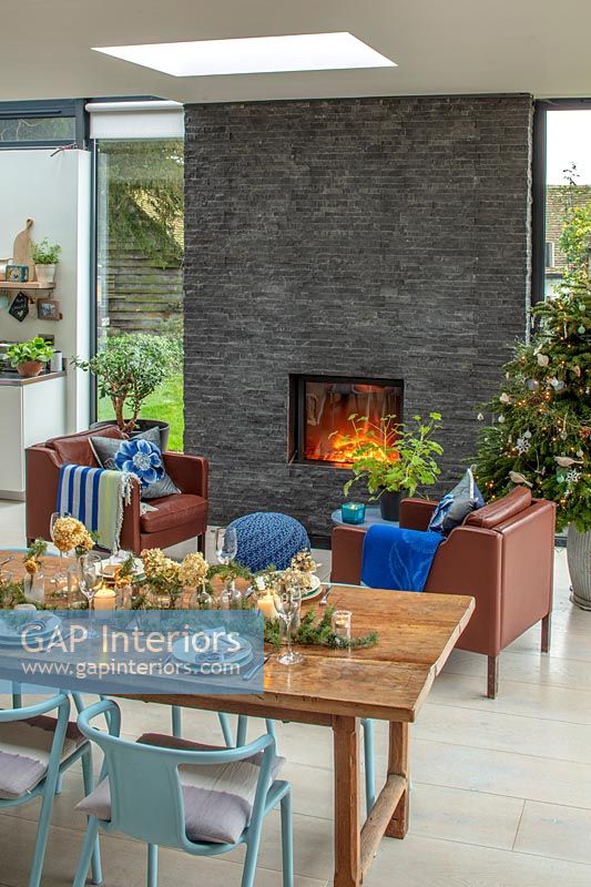 Slate fireplace in modern open plan space at Christmas 