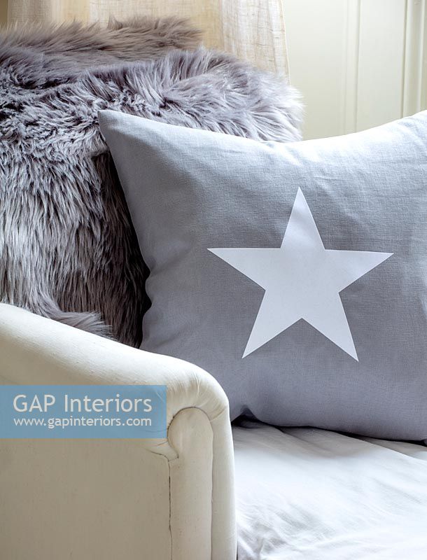 Grey and white star cushion 