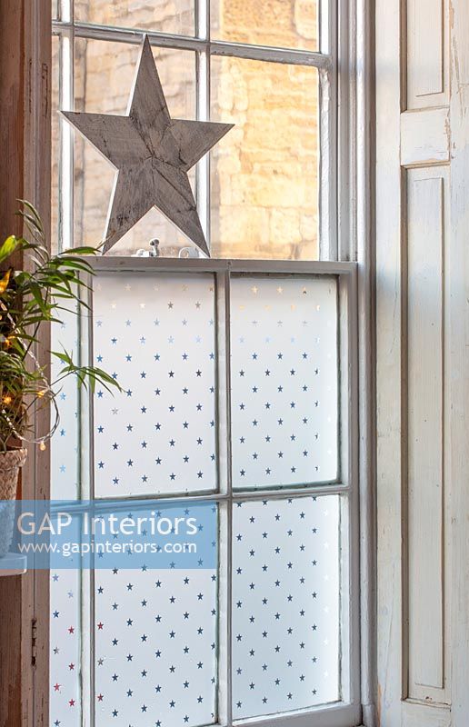 Frosted sash window with decorative star 
