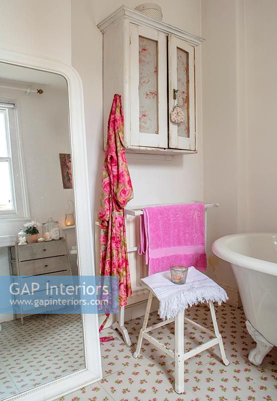 Vintage chair and mirror in classic bathroom 