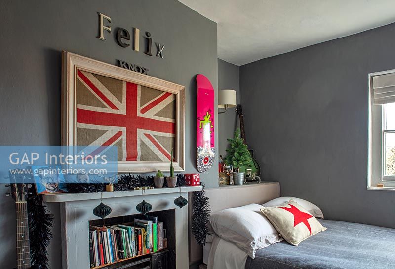 Grey painted walls in childrens room with Union Jack artwork and name on wall 