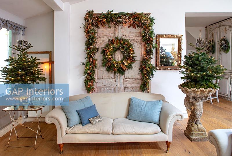Double vintage doors decorated for Christmas in country living room 