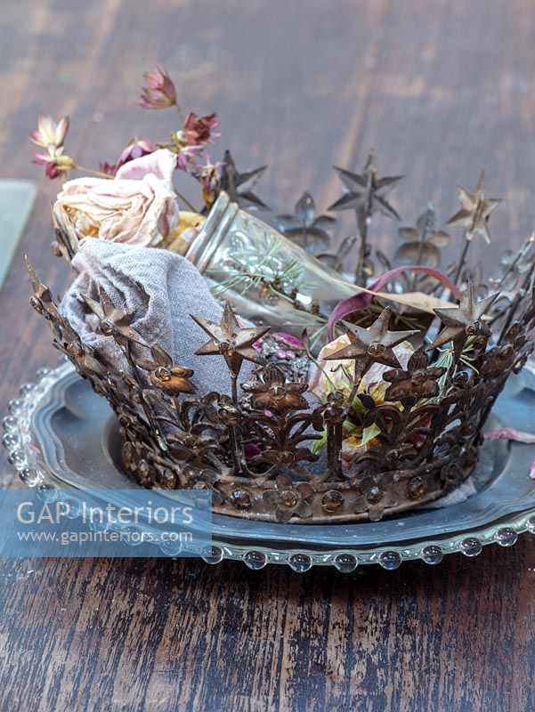 Decorative crown on Christmas table setting 