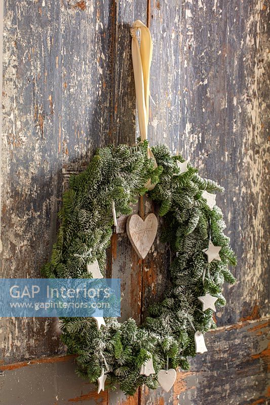 Christmas wreath on distressed wooden doors 