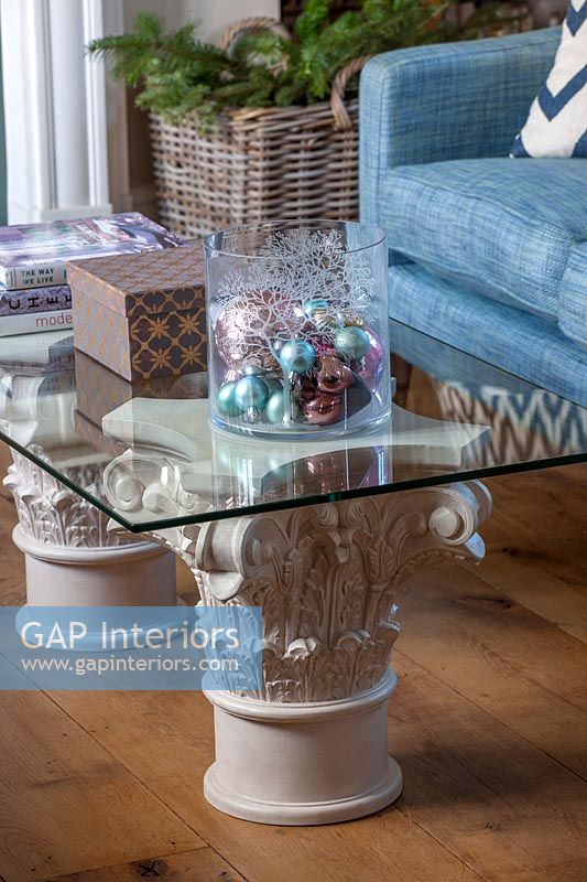 Glass top coffee table with stone pedestals 