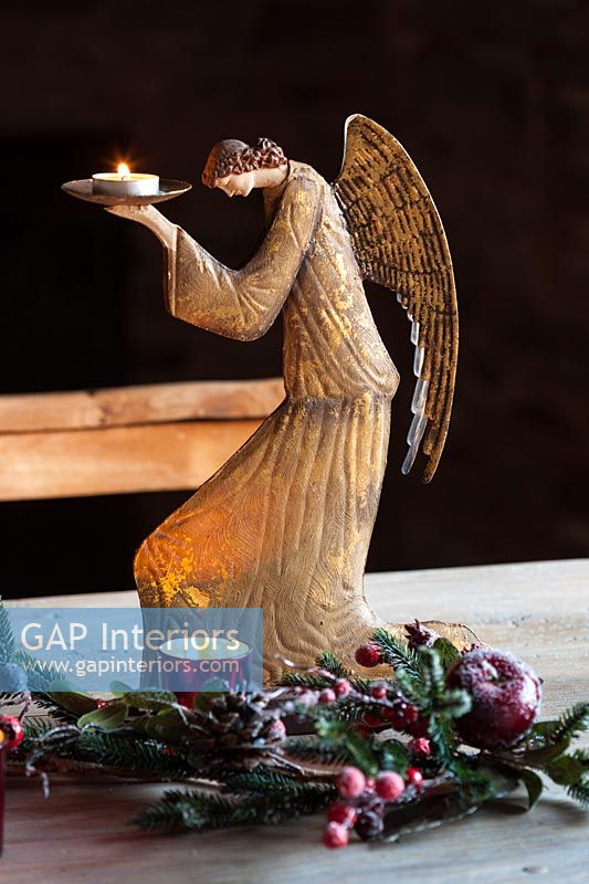 Golden angel candle holder and Christmas decorations 