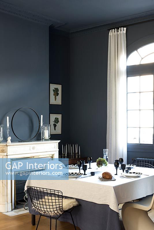 Dark blue and white dining room 