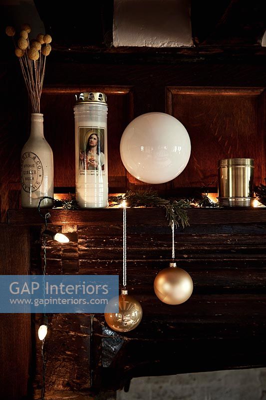 Christmas decorations on wooden mantelpiece