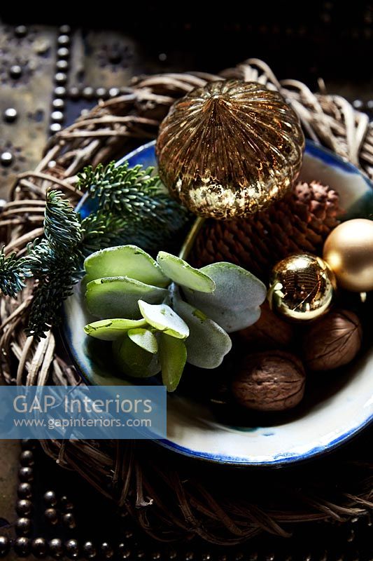 Nuts and Christmas decorations in bowl
