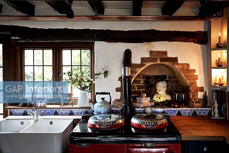 Country kitchen with red Aga stove