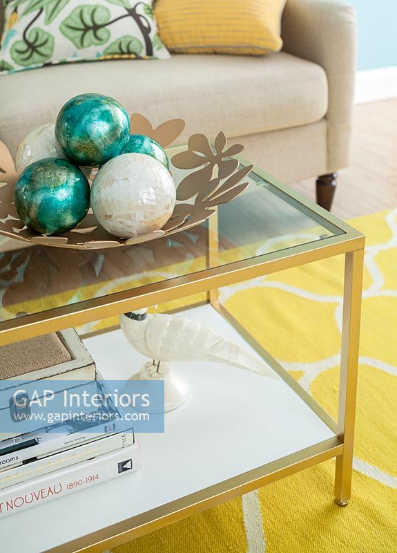 Decorative baubles on coffee table in colourful living room 