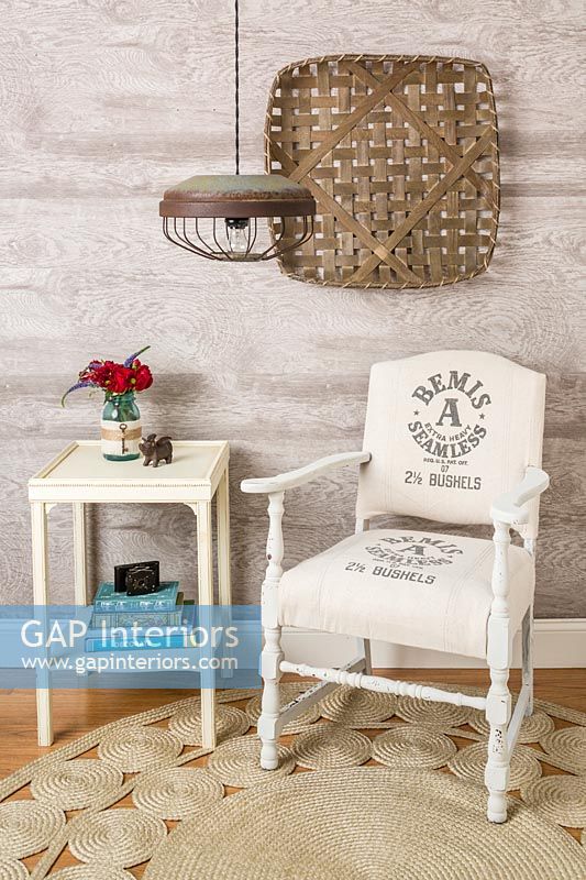 Re-covered wooden armchair and vintage side table 