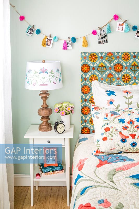 Colourful patterned headboard in modern bedroom 