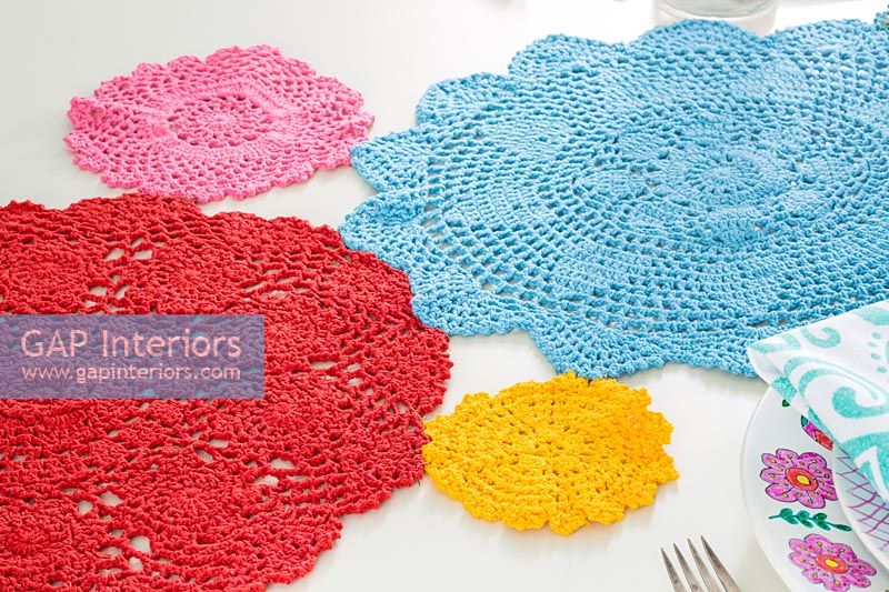 Crocheted mats on dining room table 