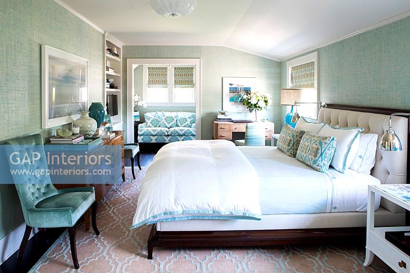 Classic bedroom with teal blue walls and furniture 