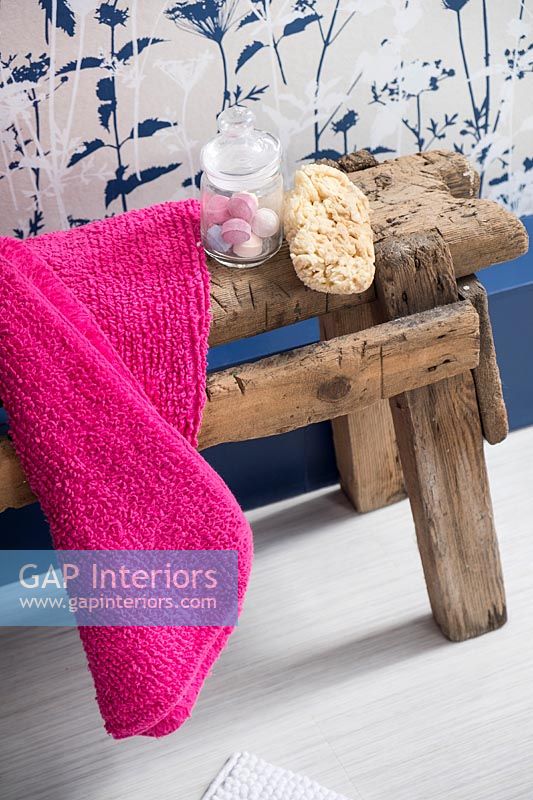 Rustic wooden stool with bathroom accessories 