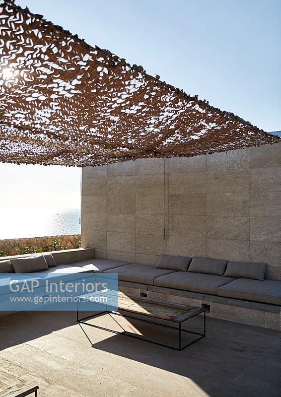 Seating area with fabric canopy and sea view 
