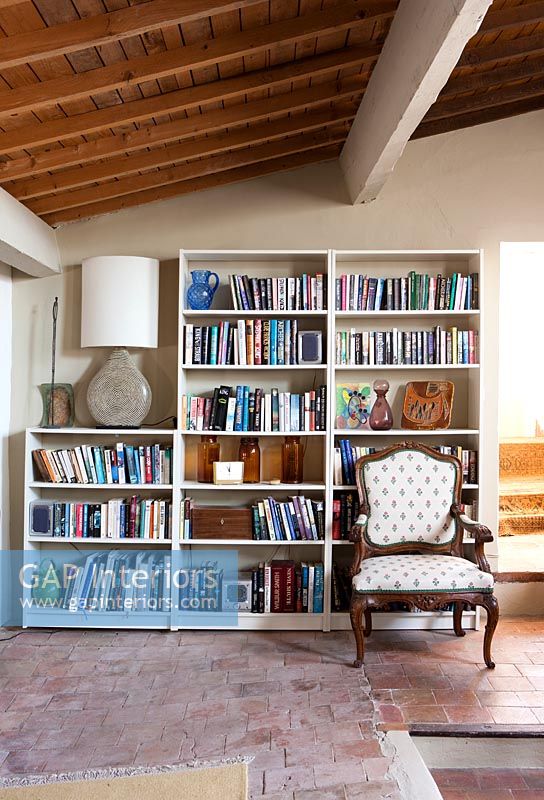 Large bookcase in country reading room 