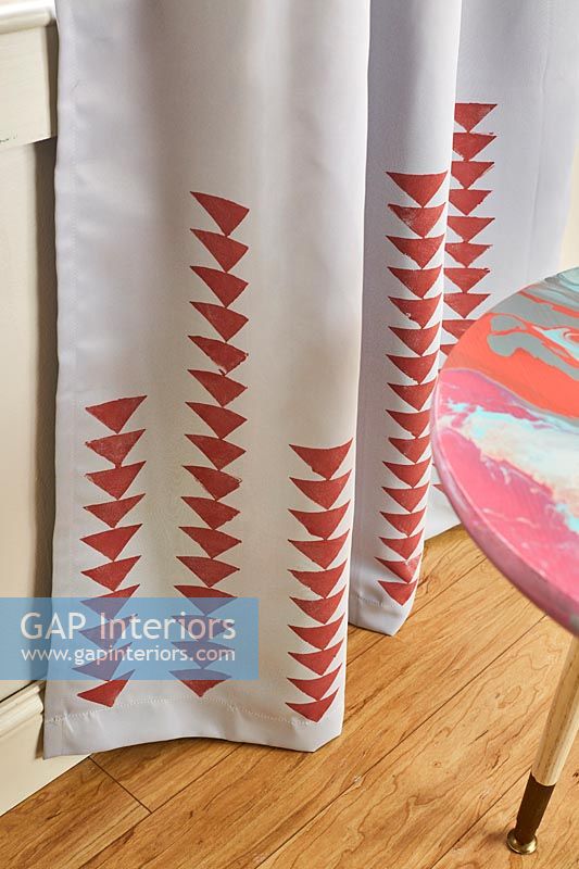 Red triangle print on curtains 