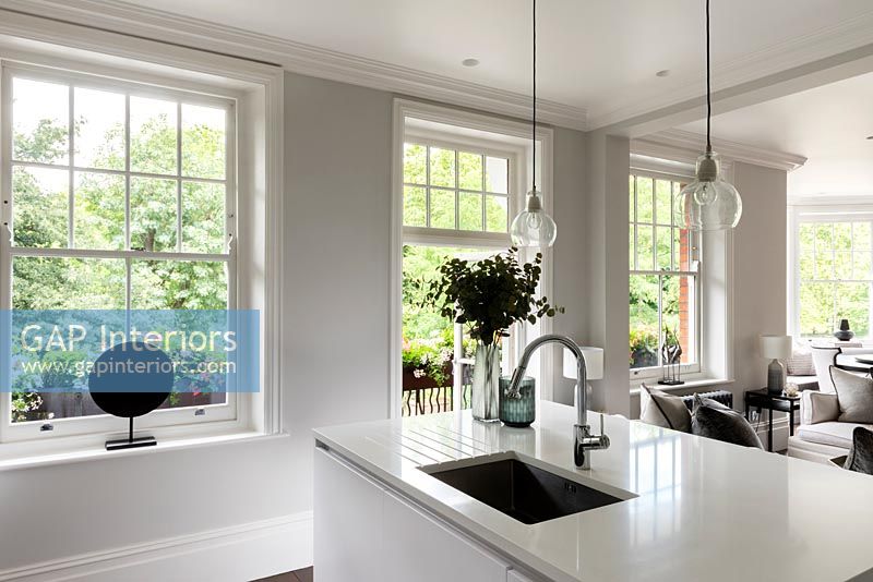 Modern monochrome kitchen with French and sash windows 