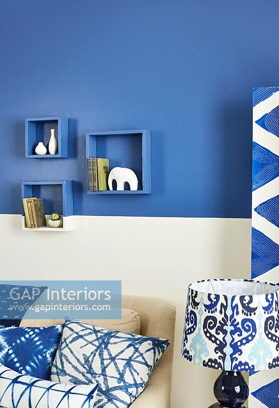 Modern living room with blue painted wall and accessories 