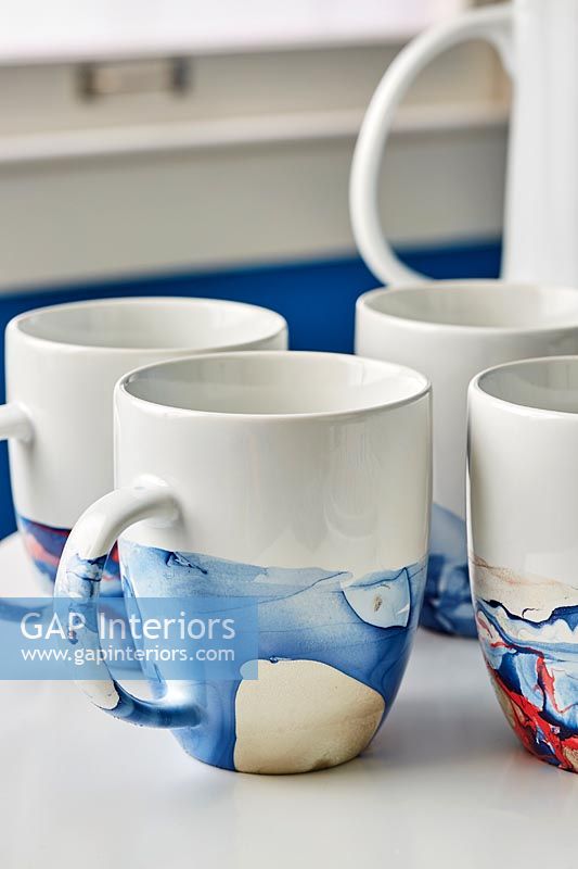 Blue and white painted coffee cups 