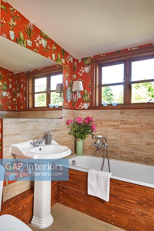 Patterned wallpaper in country bathroom 