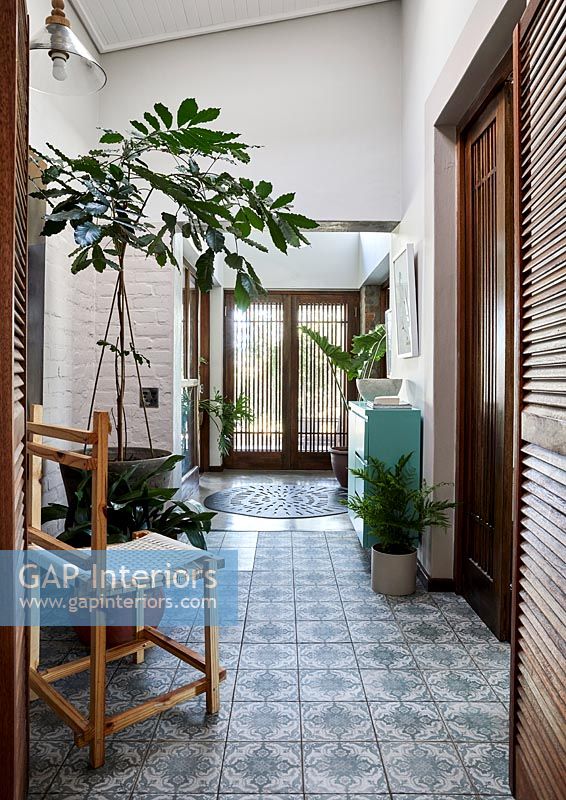 Modern country hallway with patterned floor tiles 