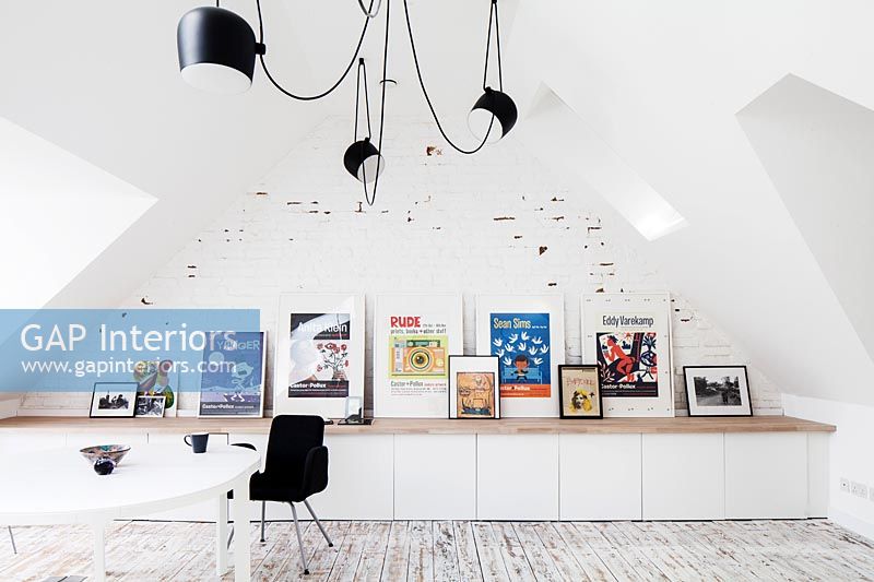 Modern home office with display of artwork 