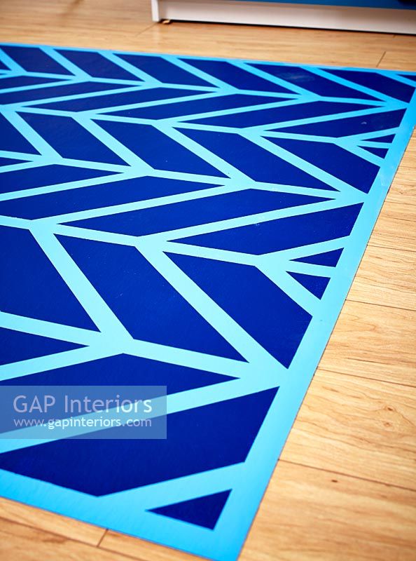 Colourful blue patterned rug 