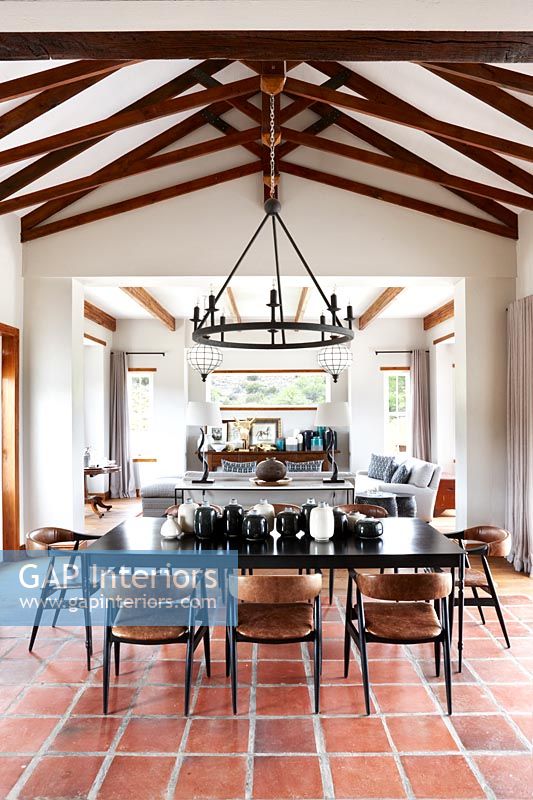 Open plan living and dining space with vaulted ceiling 
