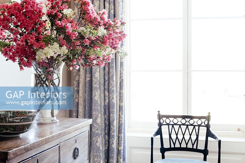 Flower arrangement and classic chair
