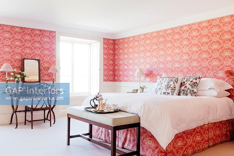 Bedroom with colourful wallpaper 