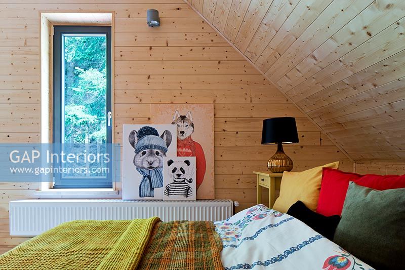 Wooden bedroom with artwork
