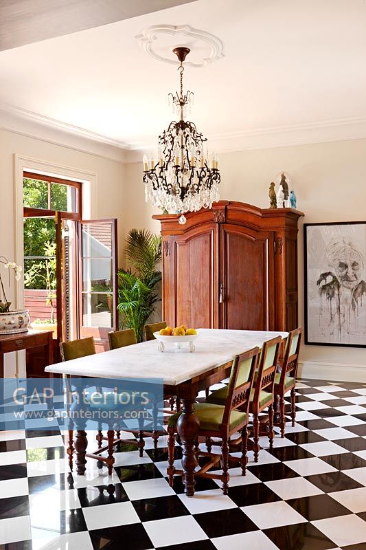 Black checkerboard floor in classic dining room 