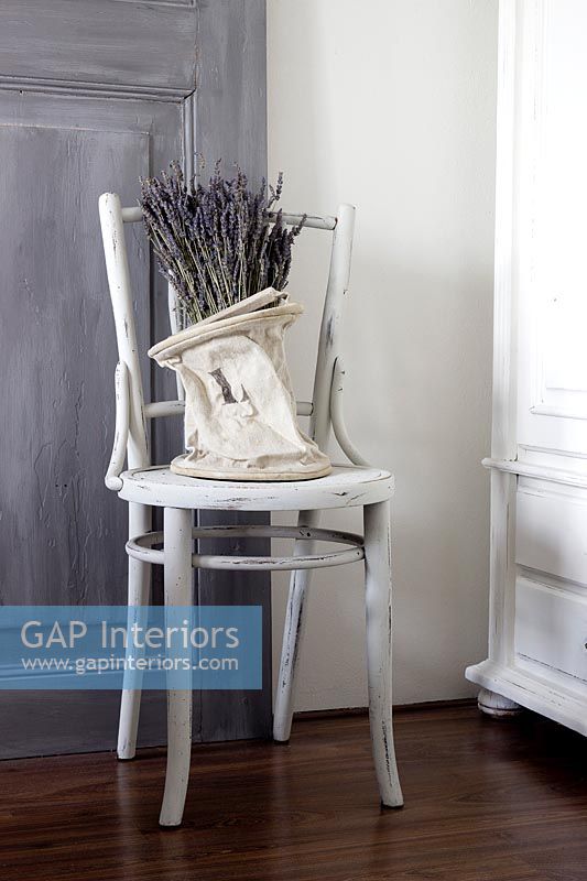 White distressed chair with lavender 