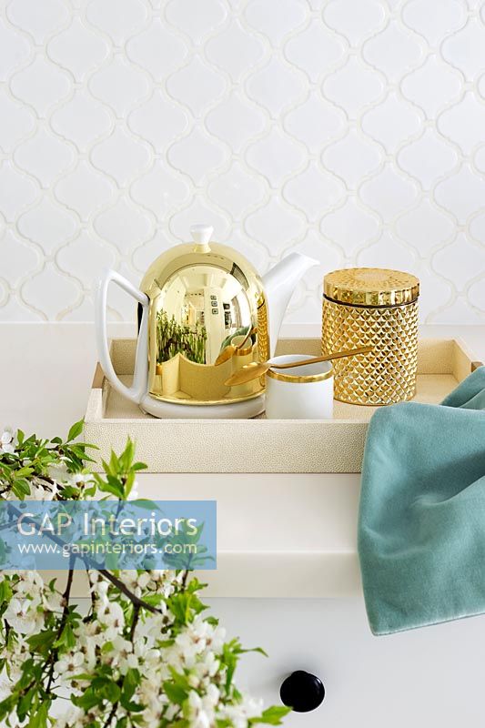 Golden teapot on kitchen counter