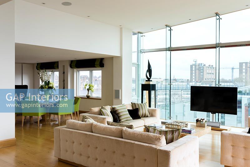 Modern open plan living room with city view 