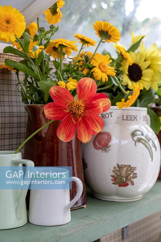 Country vases of autumn cut flowers